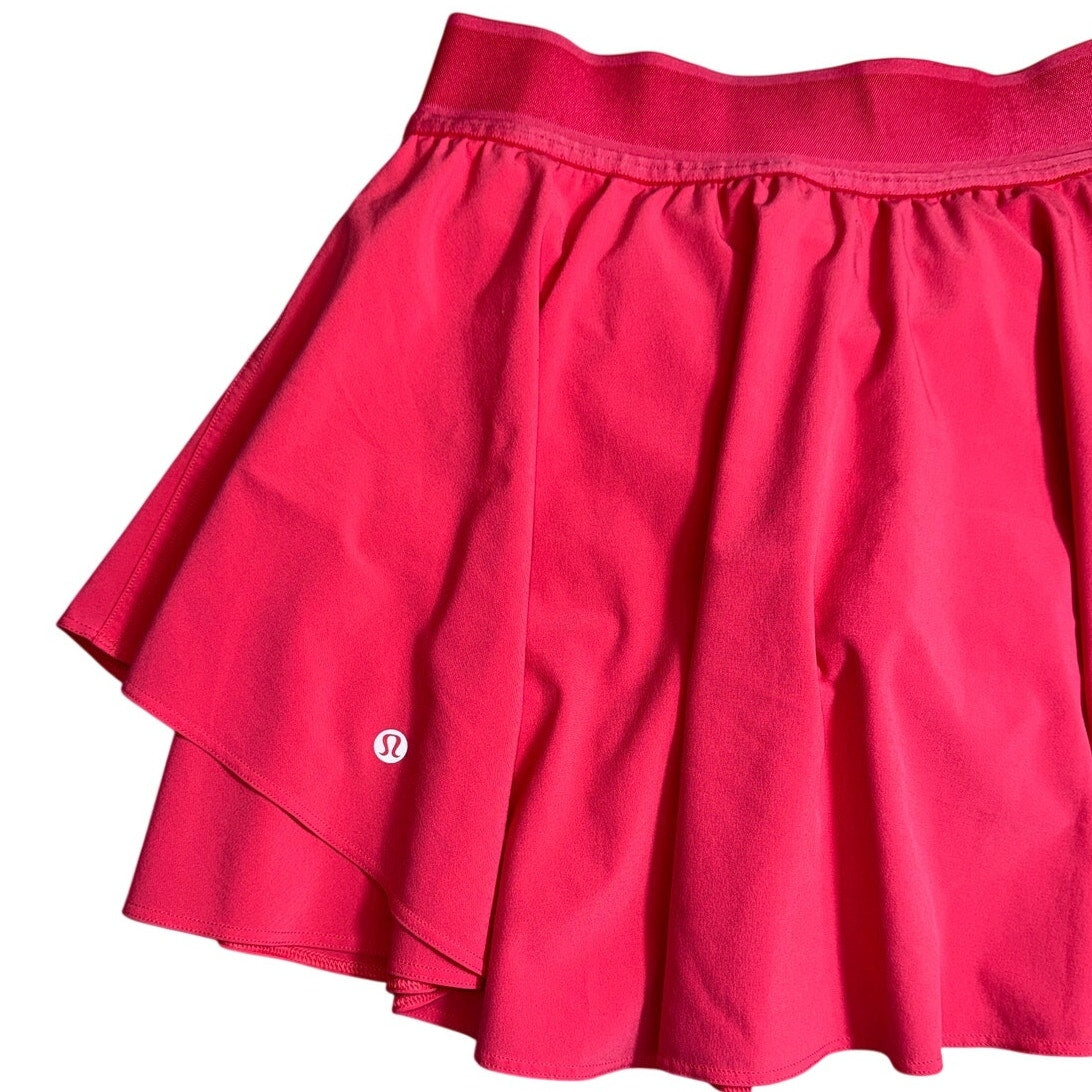 Lululemon Sonic Pink Ruffle Skort for women, size 6, in great condition, featuring a playful pink ruffle design and athletic fit.