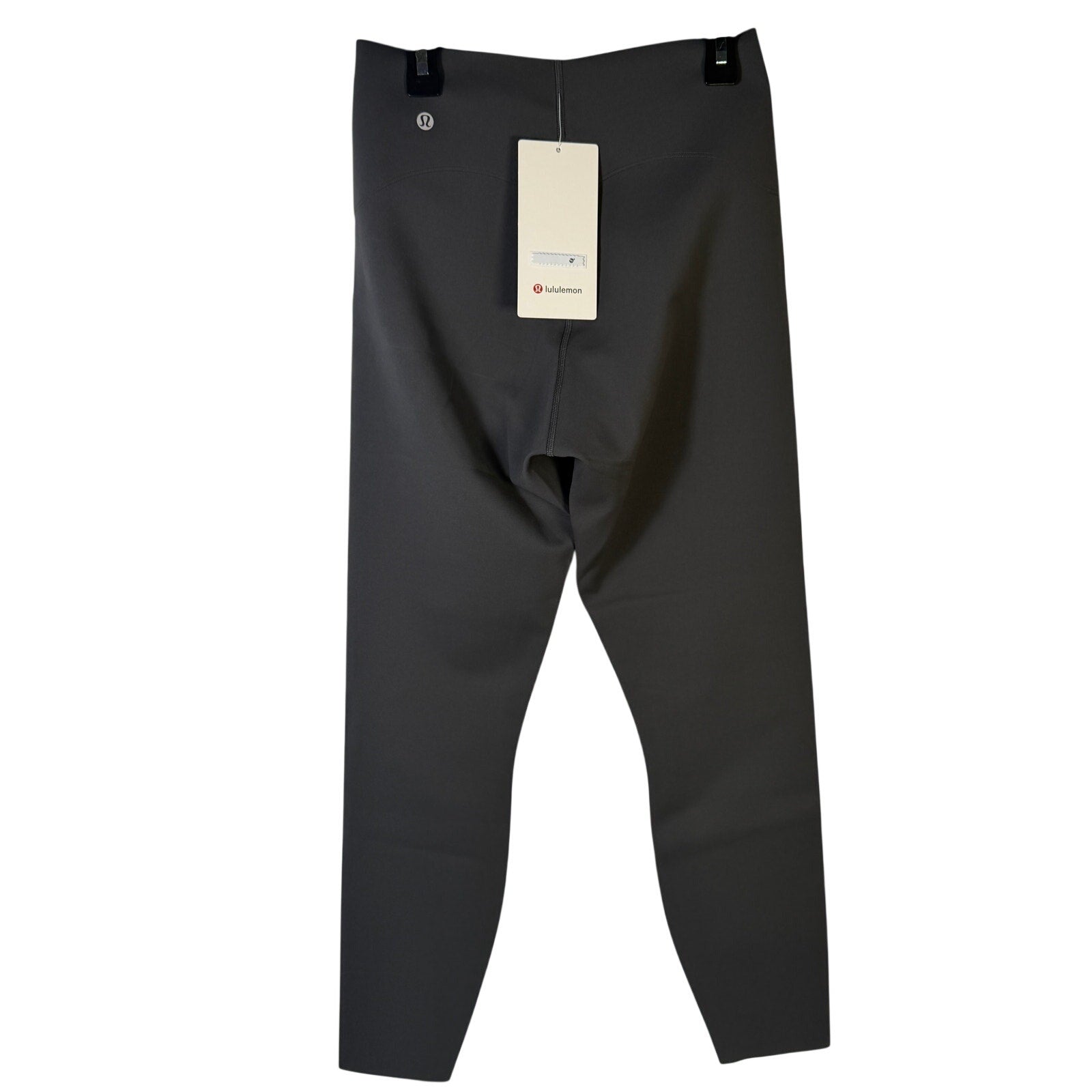 Lululemon Glow Up high-rise leggings in graphite grey, size 8, shown flat with close-up of soft, stretchy fabric.