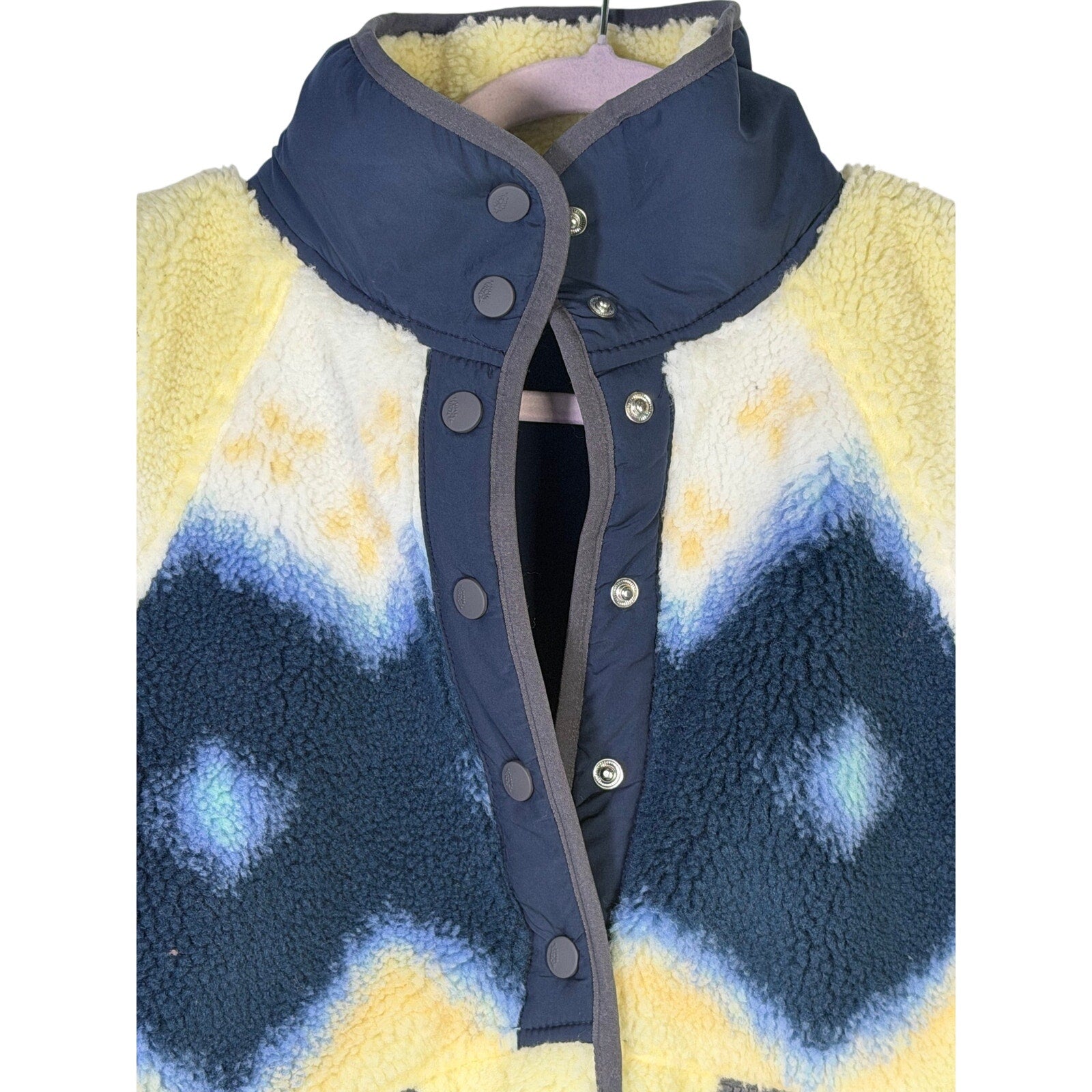 Free People women's Soft Glow Sun fleece jacket in yellow and blue, size S, showing the cozy fleece fabric and vibrant color blocking.