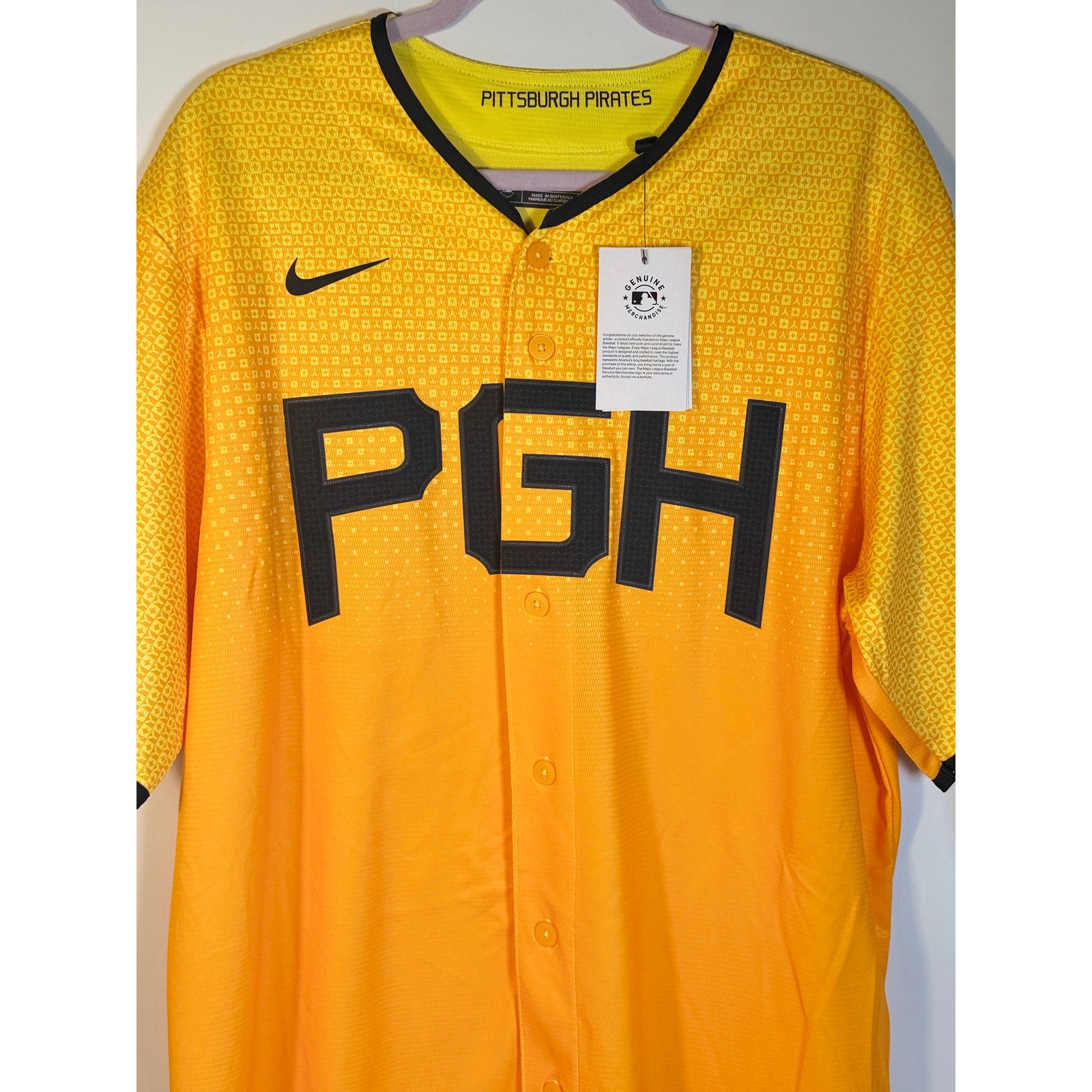 Nike Pittsburgh Pirates City Connect MLB jersey for men in gold, large size, featuring team logo and detailed design.