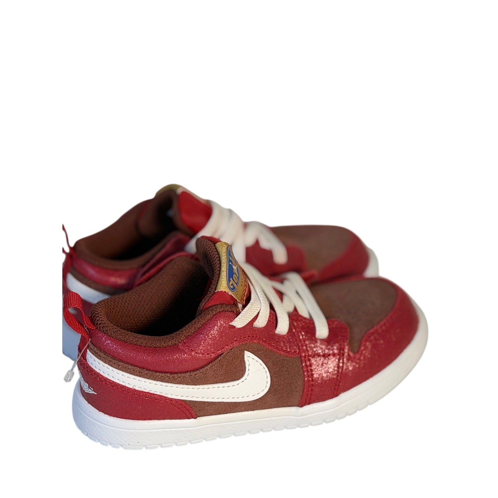 Air Jordan 1 Low ALT toddler sneakers in red, brown, and white with hook-and-loop straps, featuring the Jordan logo.