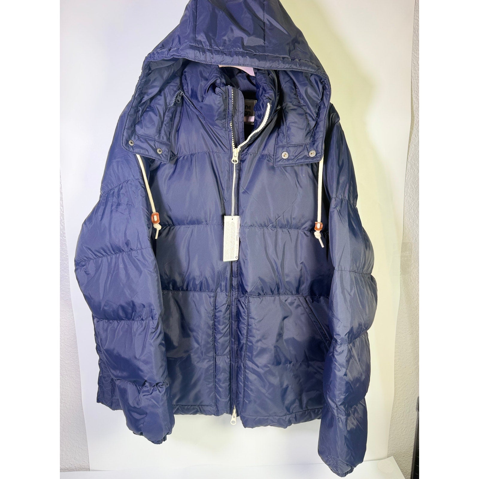 Alpine Design men's AD 1962 hooded puffer jacket in deep navy, size large, showing front view with hood and quilted design.