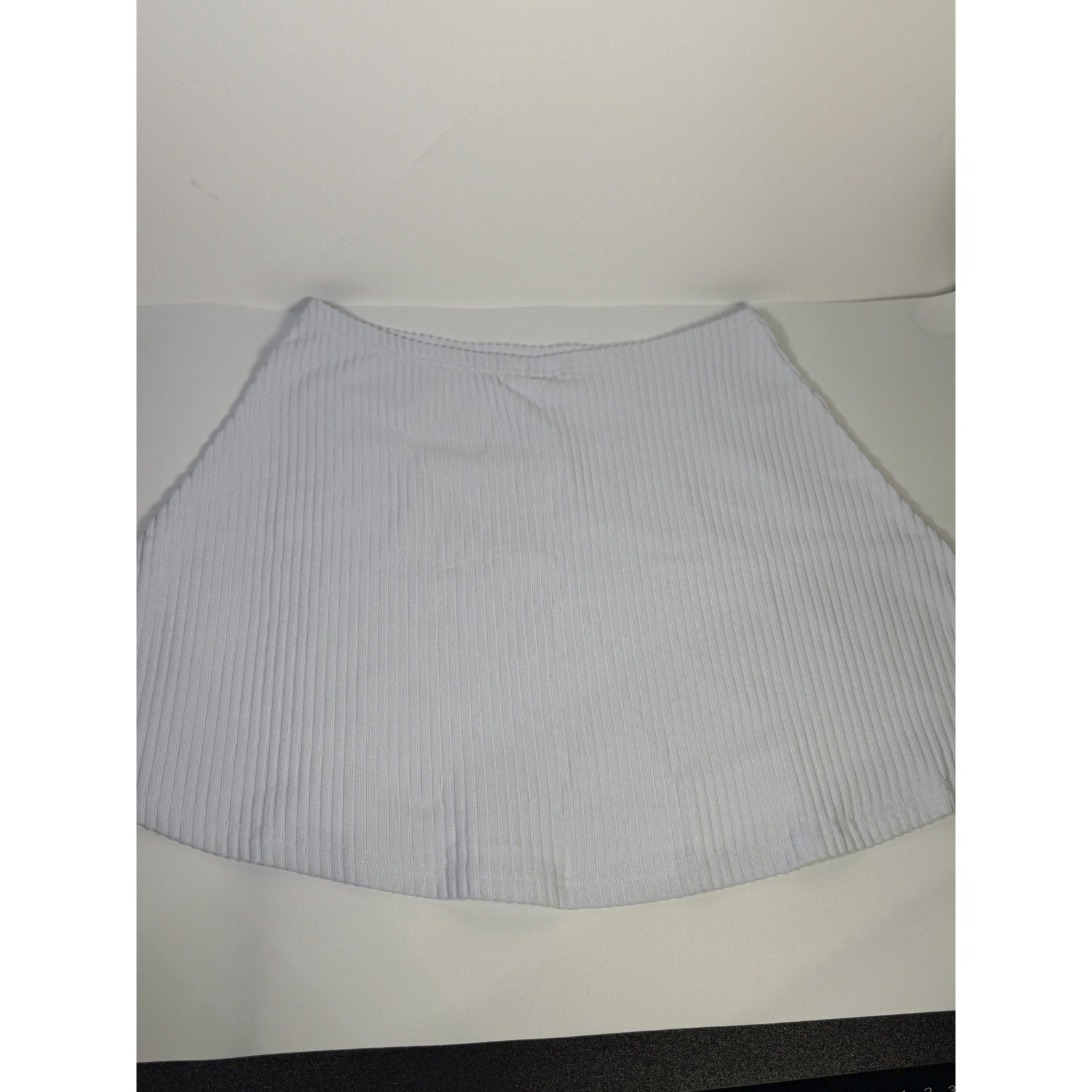 Nike women's ribbed mini skirt in sapphire mist color, size M, featuring a fitted design and ribbed fabric.